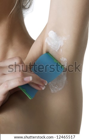 stock photo girl shaving her armpit with hairremoving cream