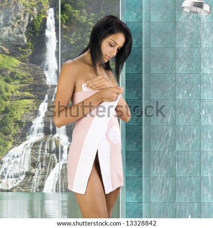 cute brunette with pink towel starting with her daily routine in bathroom