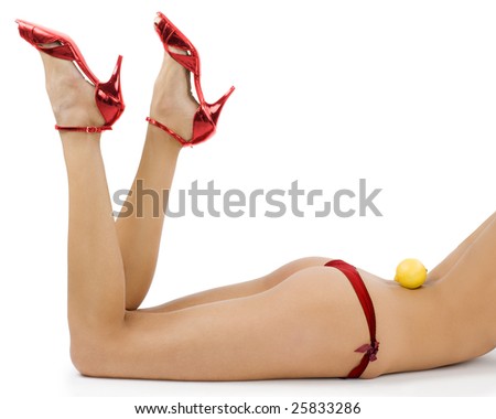 close up of sexy girl in red panties and red shoes with a lemon on back