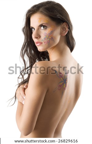 tattoo on her face. stock photo : sensual brunette with a flower tattoo on her face and on her 