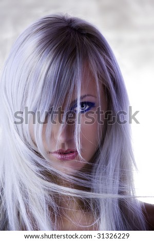 fashion portrait with  forced colors of cute blond girl with long hair