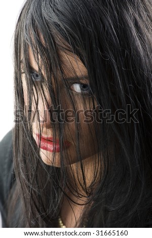 cute girl with black hair on face red lips stunning eyes looking up angry