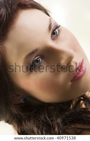 close up portrait of cute brunette with blue eyes and red lips