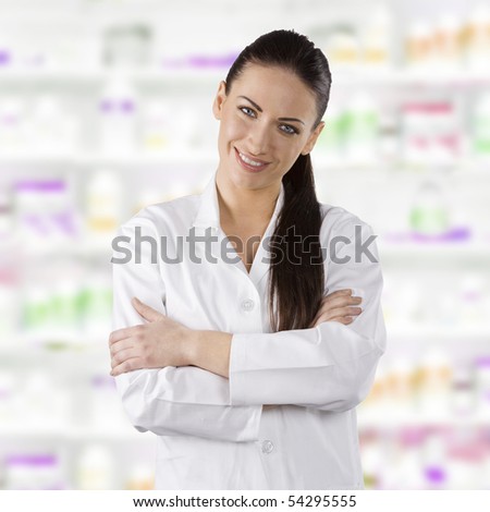 cute brunette woman in white gown as a medical doctor smiling in camera
