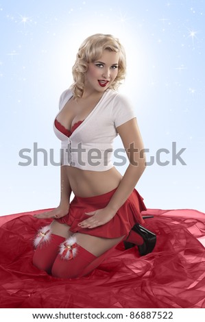 sexy blonde girl wearing red stockings, a red mini skirt and a red bra under a mini jacket posing for christmas