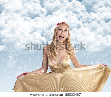very beautiful fashion girl in a golden dress celebrating christmas