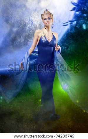 attractive stunning woman with a long elegant leather dress and a  stole with creative make up and hair style on starry space background