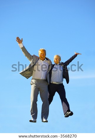 the businessman and woman jump
