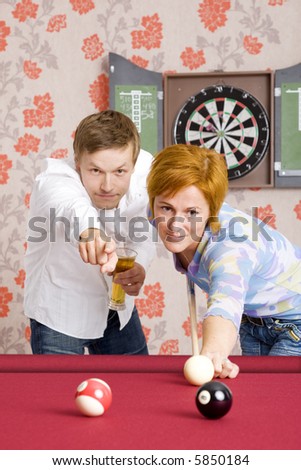 man teaching woman how to play