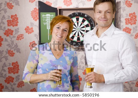 man teaching woman how to play