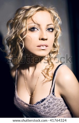 blonde in contrasting studio lighting