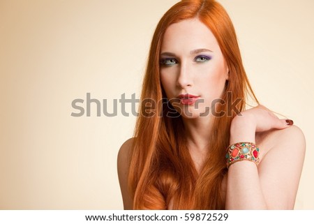 stock photo Beautiful naked redhead girl in studio