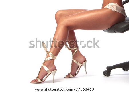 stock photo sexy feet girl sitting in a chair