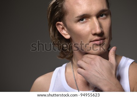male model posing in the studio, showing the positive and the beauty of the skin male persons