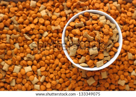 Pet Food In The Dog Dish With Background Of Pet Food Out Focus.