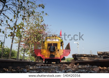 Yellow railway repair machine