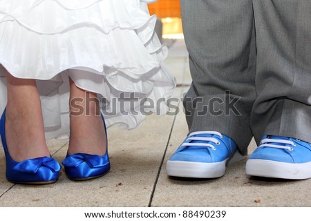 Matching Blue Shoes - Bride and Groom stand side by side with matching blue shoes
