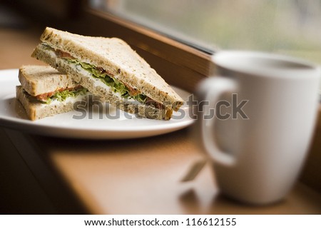 Sandwiches and a cup of tea in the window