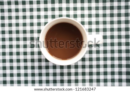 coffee cup on chequered cloth