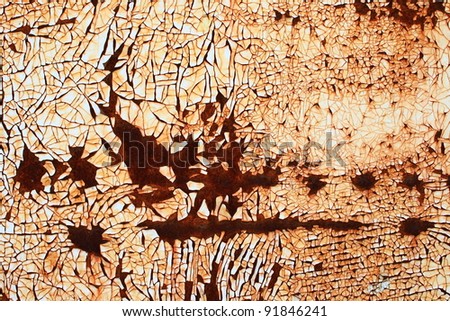 Rusty background A rusty old metal plate with cracked white gloss paint