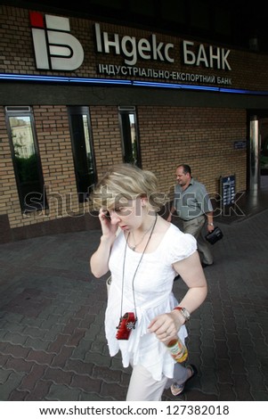 KIEV - JULY 12: Pedestrians walk by an Indexbank AS branch office in Kiev, Ukraine, on Wednesday, July 12, 2006.