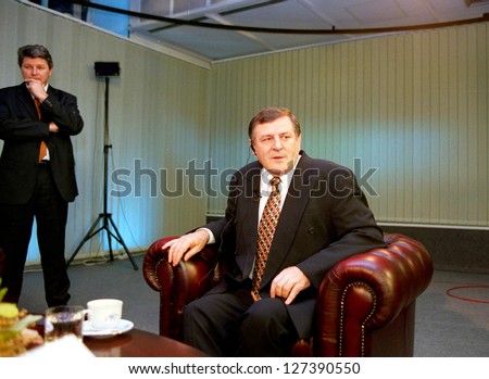 BRATISLAVA - AUGUST 26: Slovak Prime Minister Vlademir Mecier makes small talk before beginning his TV show on state television, on August 26, 1998. (C) Photo Credit: Mark H. Milstein/ Northfoto