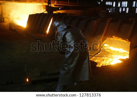 KOSICE - APRIL 25:  Workers in a computer controlled operation\'s center keep an eye on production at the cold rolling plant  of U.S. Steel Kosice, s.r.o in Kosice, Slovakia, on April 25, 2005.