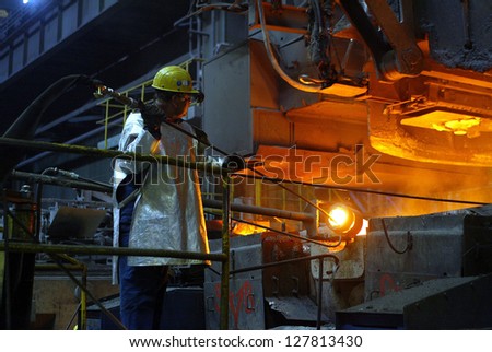KOSICE - APRIL 25:  Workers in a computer controlled operation\'s center keep an eye on production at the cold rolling plant  of U.S. Steel Kosice, s.r.o in Kosice, Slovakia, on April 25, 2005.