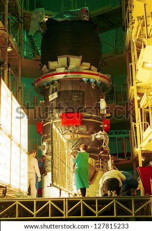 BAIKONUR COSMODROME, - OCTOBER 30: Russian space engineers piece together a Progress M1 spacecraft in the RSC Energia assembly building at the Cosmodrome in Baikonur, Kazakhstan, on October 30, 2000.
