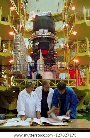 BAIKONUR COSMODROME - OCTOBER 29 2000:  Russian space technicians and engineers test the solar array on a Progress M1 spacecraft in the RSC Energia vehicle assembly building on OCTOBER 29 2000 in Baikonur, Kazakhstan