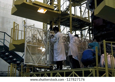 BAIKONUR COSMODROME - OCTOBER 29 2000:  Russian space technicians and engineers test the solar array on a Progress M1 spacecraft in the RSC Energia vehicle assembly building on OCTOBER 29 2000 in Baikonur, Kazakhstan