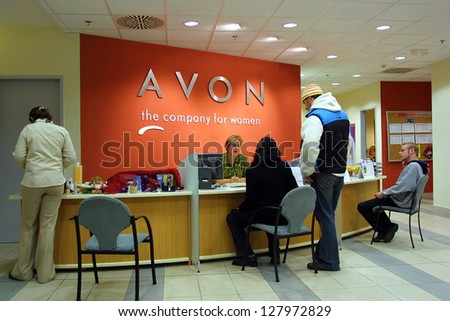 BUDAPEST - NOVEMBER 12: Shoppers speak with a retail representative at an office of Avon cosmetics in Budapest, Hungary, on November 12, 2003.