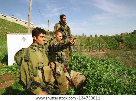 YUVAL, ISRAEL - MARCH 28: Israeli army soldiers (IDF) on a foot patrol along the Israeli border with Lebanon on March 28, 2000.