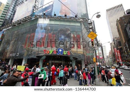 NEW YORK CITY - APRIL 19: People crows in front of the Toys R Us store in Times Square in New York City, on Friday, April 19, 2013.