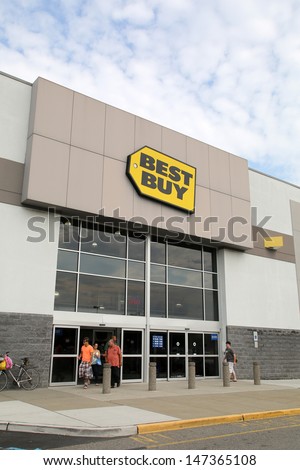 PARAMUS - JULY 9: Shoppers walk past a Best Buy consumer electronics store in Paramus, New Jersey, on Tuesday, July 9, 2013.