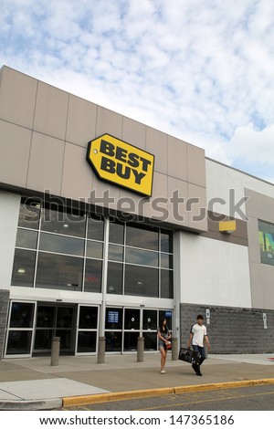 PARAMUS - JULY 9: Shoppers walk past a Best Buy consumer electronics store in Paramus, New Jersey, on Tuesday, July 9, 2013.