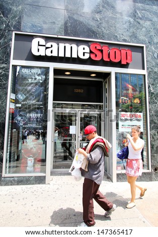 NEW YORK CITY - JULY 8: Shoppers walk past a GameStop retail store in New York City, New York, on Monday, July 8, 2013. GameStop Corp is an American video game and entertainment software retailer.