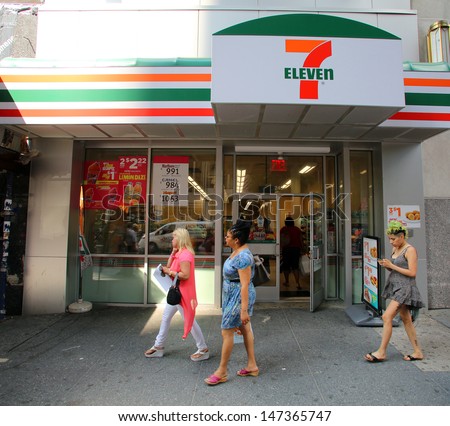 NEW YORK CITY - JULY 8: Pedestrians walk past a 7-Eleven convenience store in New York City, New York, on Monday, July 8, 2013.