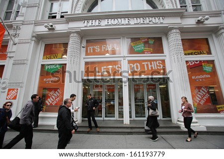 NEW YORK CITY - OCT 23 2013: Shoppers walk past The Home Depot retail home improvement store in Manhattan on Wednesday, October 23, 2013.