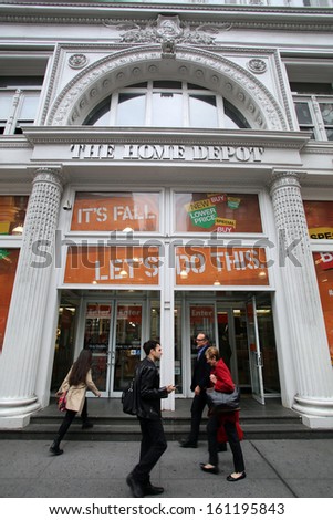 NEW YORK CITY - OCT 23 2013: Shoppers walk past The Home Depot retail home improvement store in Manhattan on Wednesday, October 23, 2013.