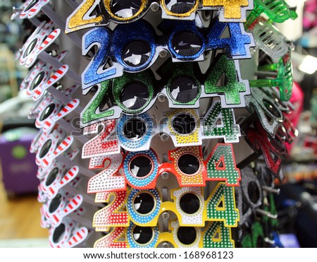 NEW YORK CITY - DECEMBER 28, 2013: Novelty glasses celebrating New Year\'s Eve 2014 on display at a shop in Times Square.