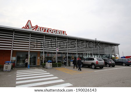 BOLOGNA, ITALY - APRIL 19, 2014: Travellers stand outside an Autogrill S.p.A restaurant and mini market in Bologna, Italy, on Saturday, April 19, 2014.