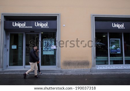BOLOGNA, ITALY - APRIL 19, 2014: Pedestrians walk past a Unipol Banca S.p.A bank office in Bologna, Italy, on Saturday, April 19, 2014.