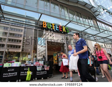 BERLIN, GERMANY - JUNE 11, 2014: Pedestrians walk past a Butlers home accessories store in  Berlin, Germany, on Saturday, June 11, 2014