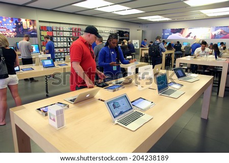 LAS VEGAS, NEVADA - FRI. JUNE 27, 2014:  People  shop at an Apple Computers retails store in Las Vegas, Nevada, on Friday, June, 27, 2014.