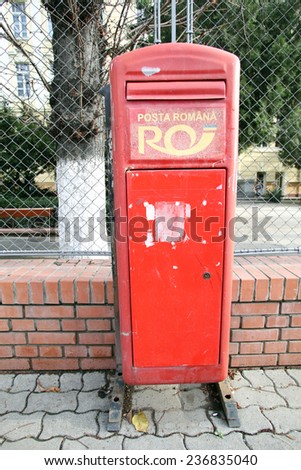 ARAD, ROMANIA - FRIDAY, DECEMBER 5, 2014: A postal box owned and managed by CN Posta Romana SA; the national operator in the field of postal services in Romania
