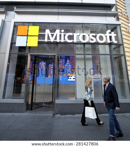 NEW YORK CITY - FRIDAY, MAY 8, 2015: Pedestrians walk past the corporate offices of Microsoft in Manhattan. Microsoft is an American technology company.