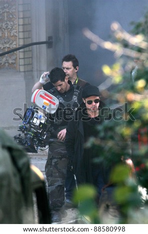 BUDAPEST - OCTOBER 13: Brad Pitt takes photos on the set of Angelina Jolie\'s film directing debut currently in production in Budapest, Hungary, on Wednesday, October 13, 2010.