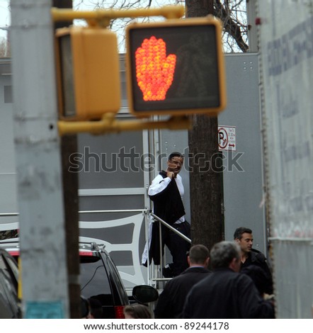 NEW YORK CITY - APRIL 15: Actor Will Smith seems surprised to find fans waiting for him outside his trailer on the set of Men In Black 3 (MIB3) which is being filmed in New York, NY on April 15, 2011.