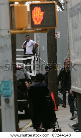 NEW YORK CITY - APRIL 15: Actor Will Smith seems surprised to find fans waiting for him outside his trailer while working on the set of \